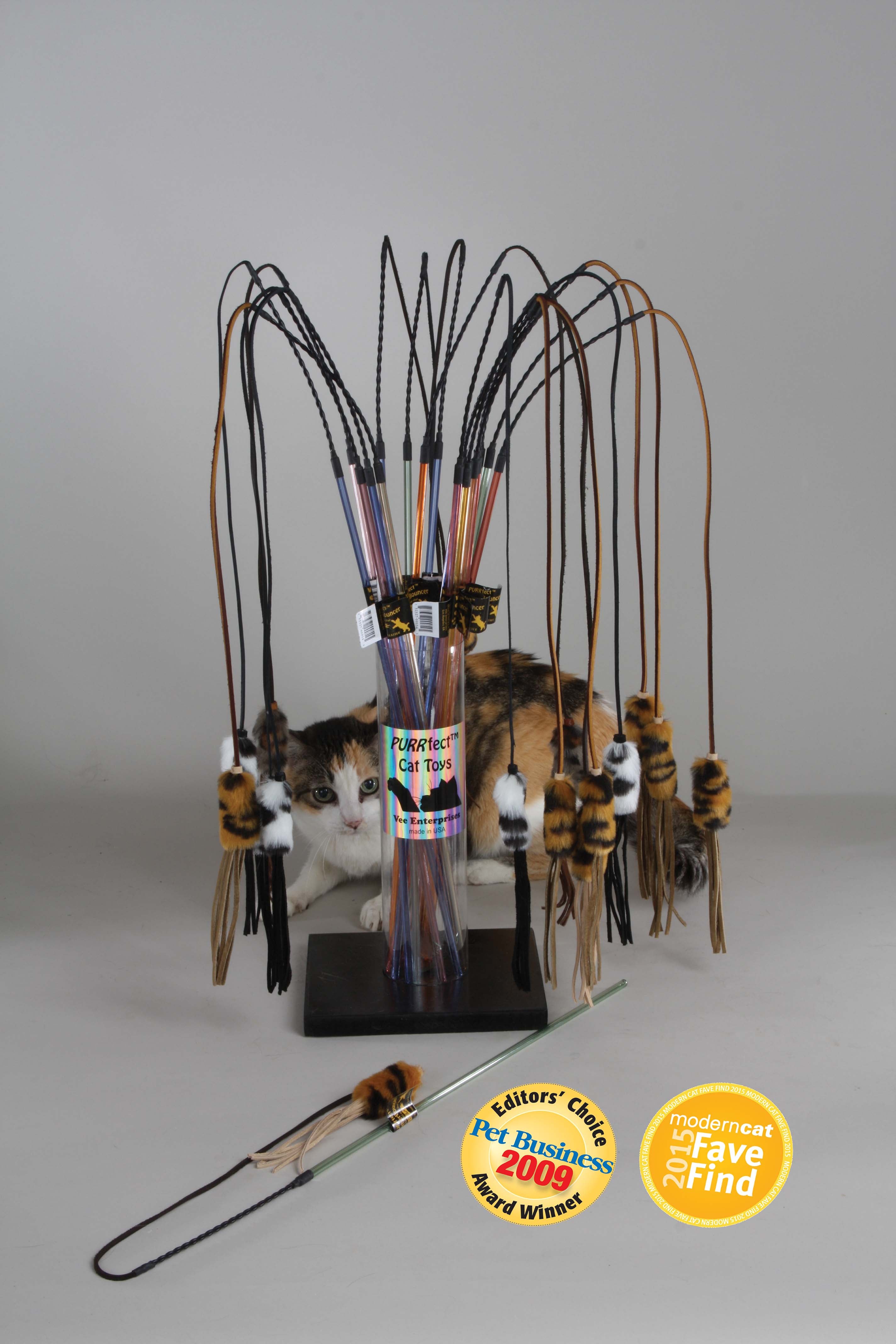 Catnip toy with multiple catnip mice on a stand against a gray background
