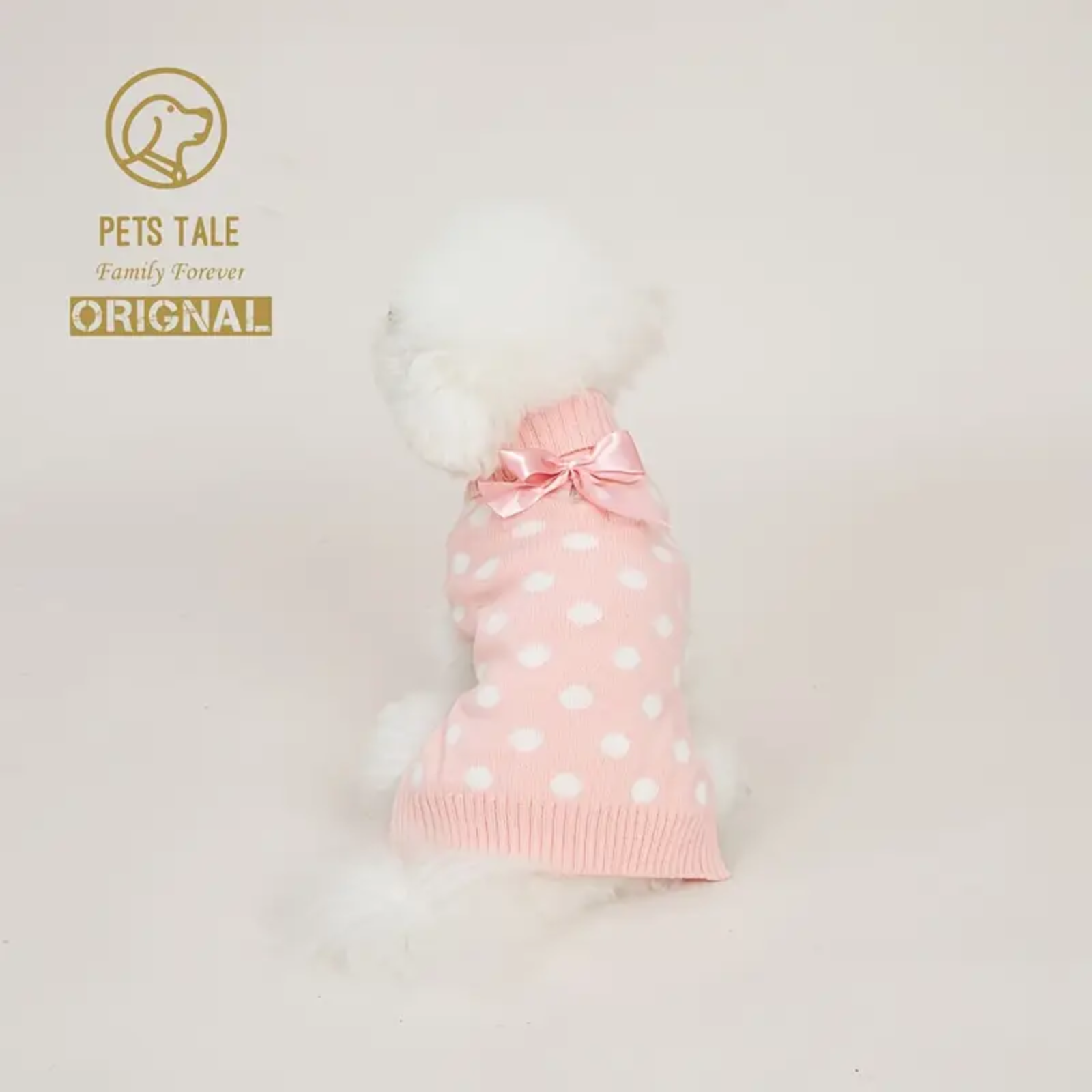 Pink polka dot pet dress with a bow on a white background, branded 'Pets Tale'.