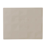 Beige cutting board with 'Fuzzyard' branding on a white background