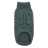Green knitted dog sweater on a white background