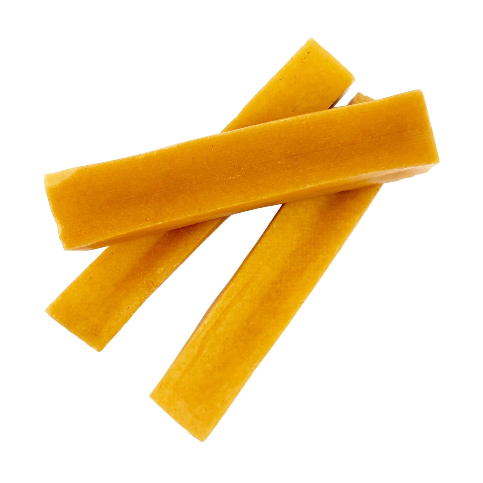 Three yellow dog treats on a white background