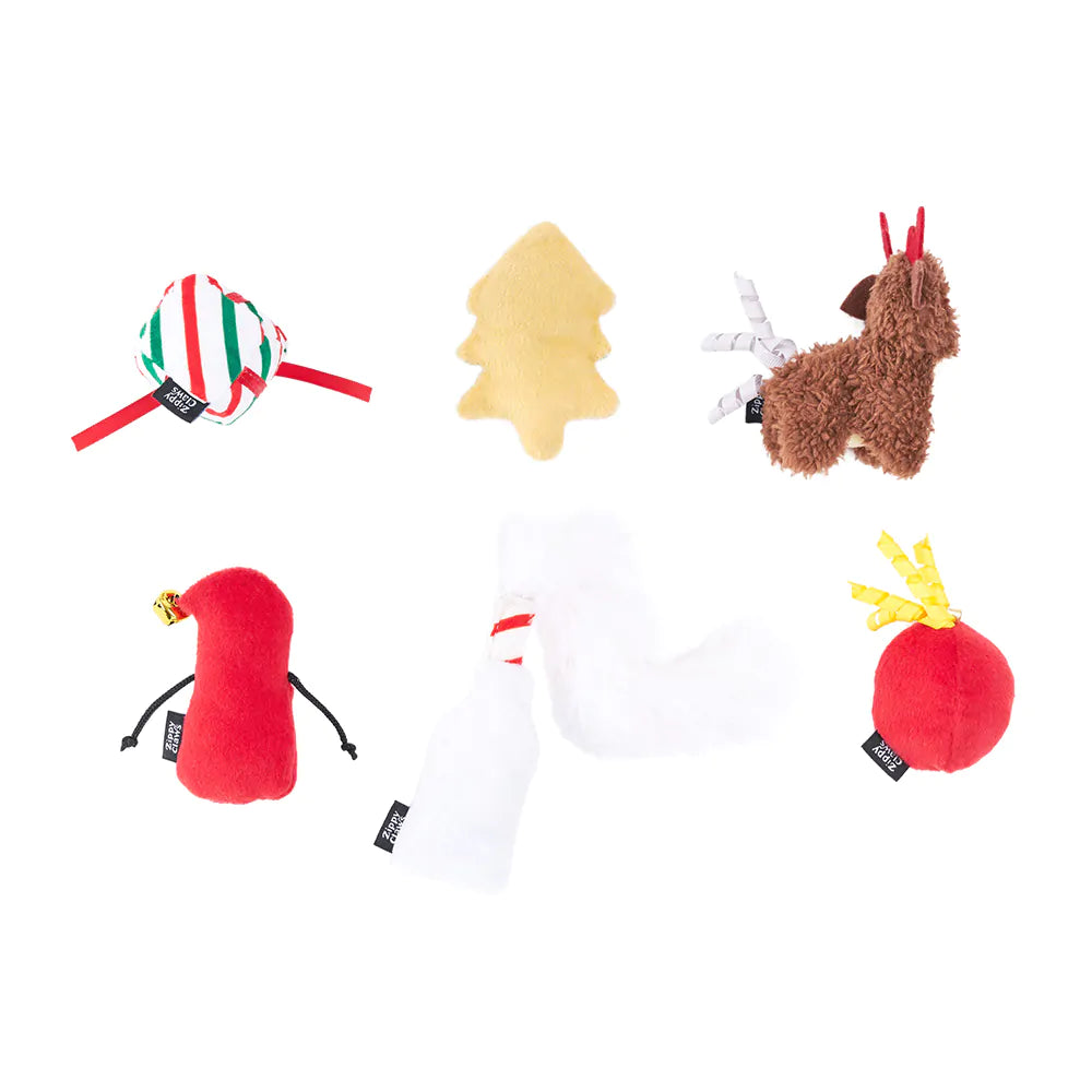 Collection of various dog toys on a white background