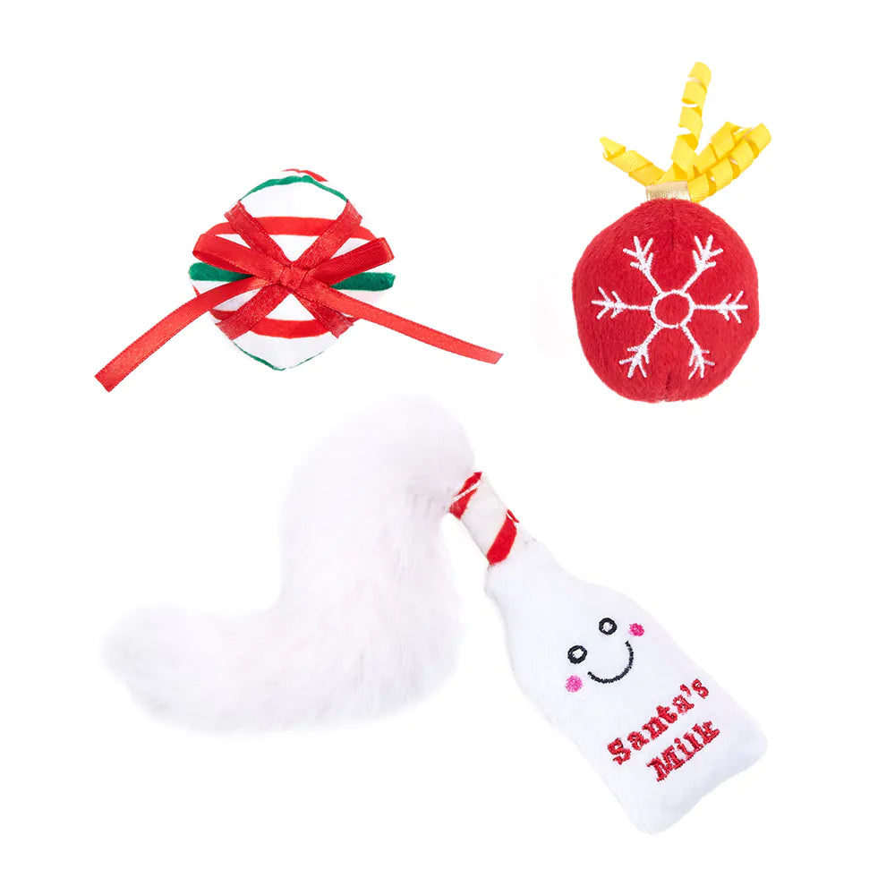 Set of Christmas-themed items including a bottle, candy cane, and snowflake ornament on a white background.