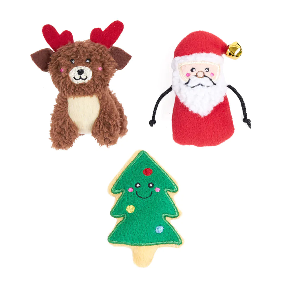 Three Christmas-themed toys: a reindeer, Santa Claus, and a Christmas tree on a white background.