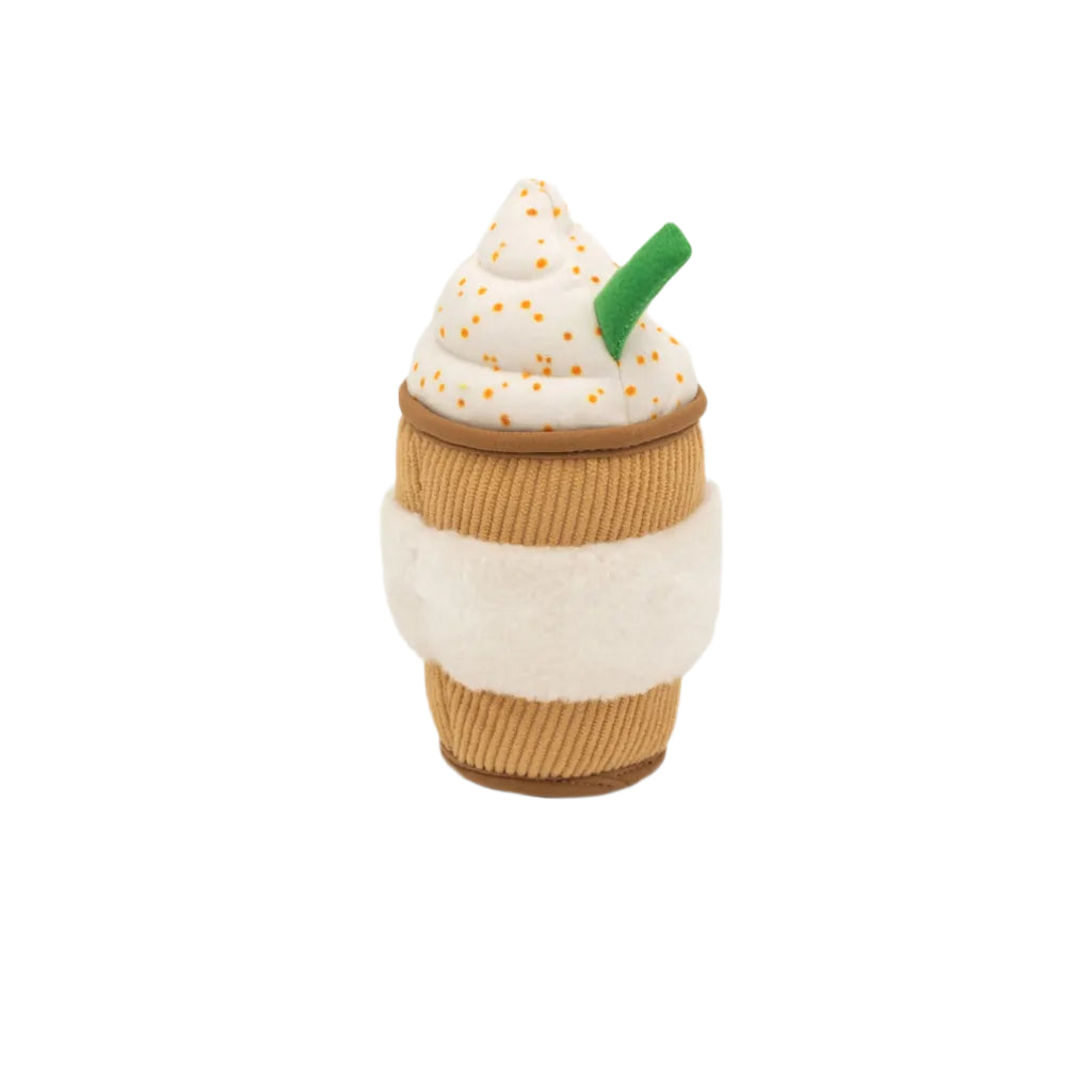 Toy resembling a coffee cup with whipped cream and a green straw on a white background