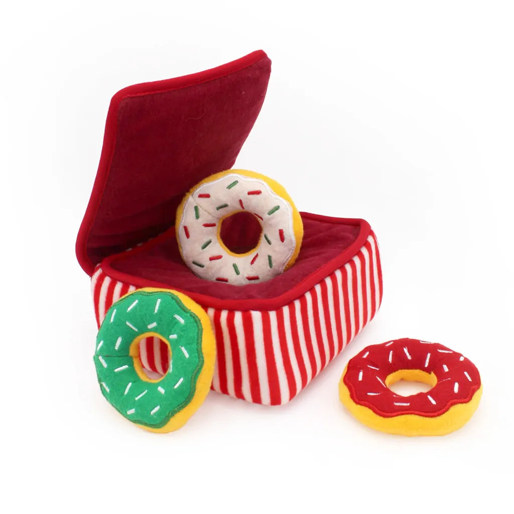 Red striped box with a donut-shaped toy inside, on a white background
