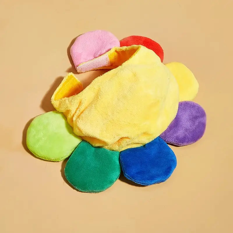 Colorful flower-shaped plush toy on a beige background