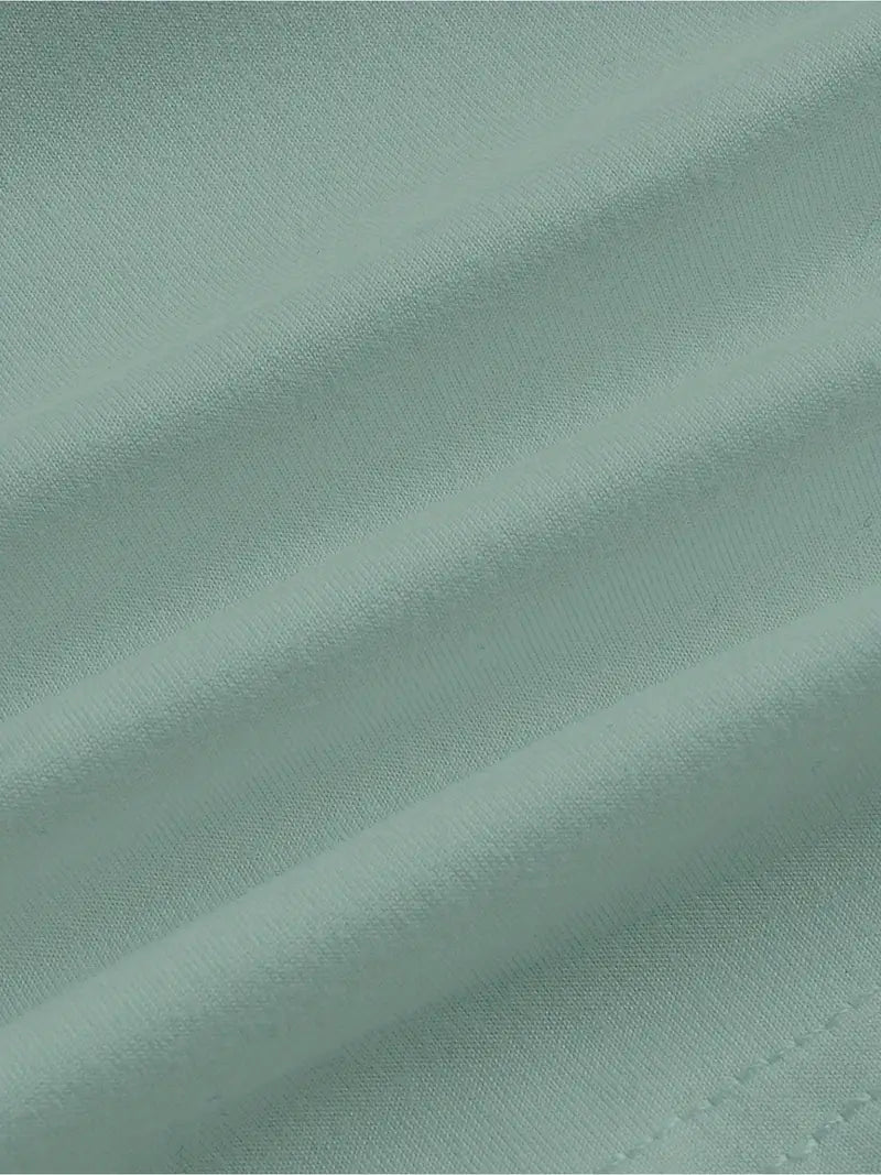 Close-up of teal fabric with visible texture