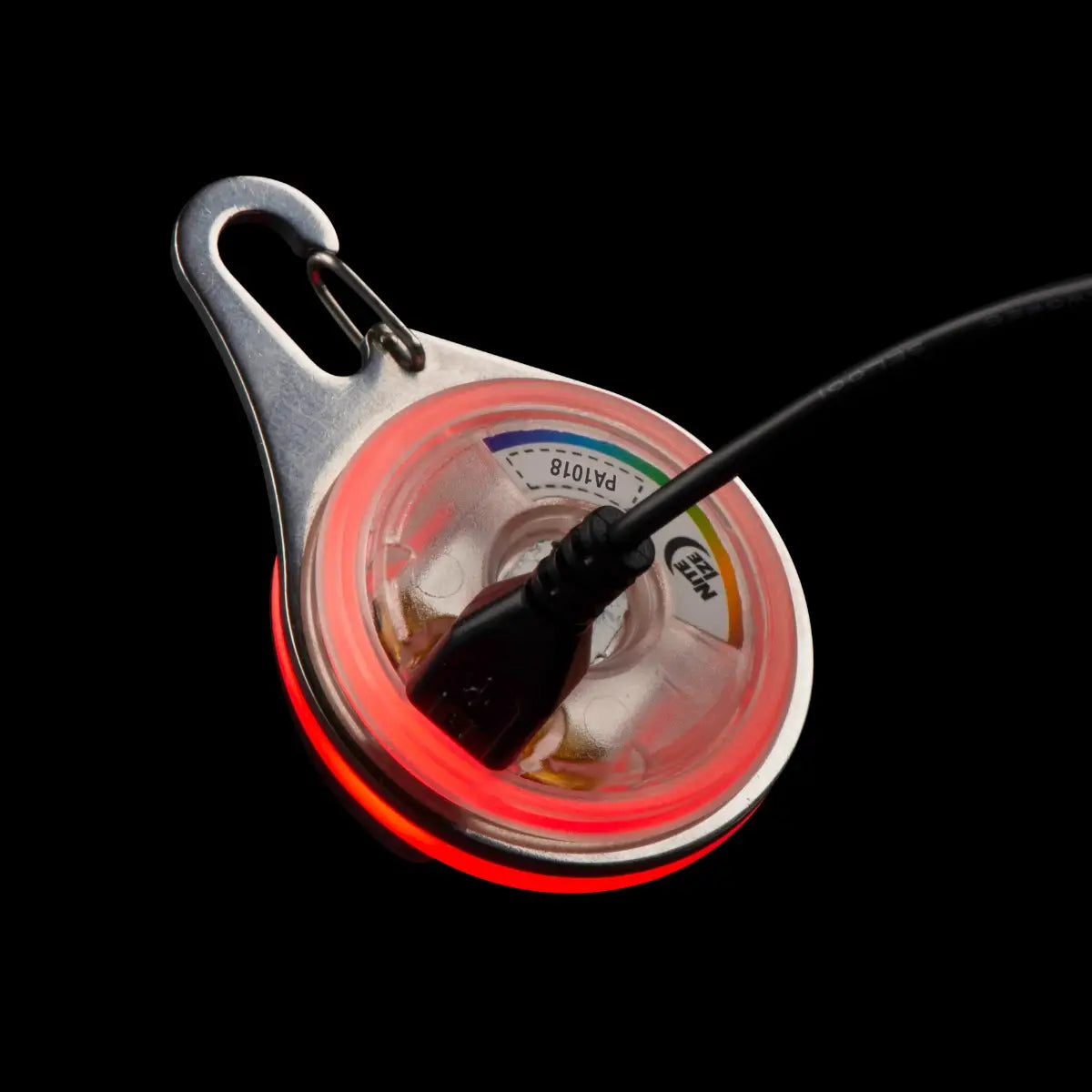 Fishing reel with red light on a black background