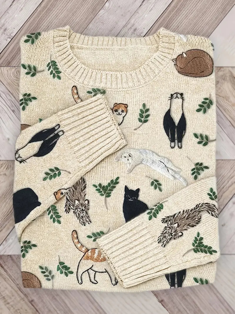 Folded sweater with animal pattern on a wooden surface