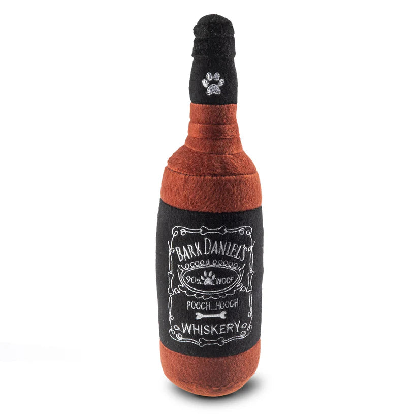 Dog toy shaped like a bottle with 'Bark Daniel's Whiskery' text on a white background