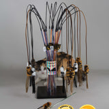 Catnip toy with multiple catnip mice on a stand against a gray background