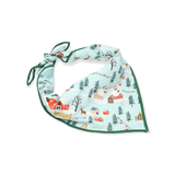 Baby bib with winter village design on a light blue background