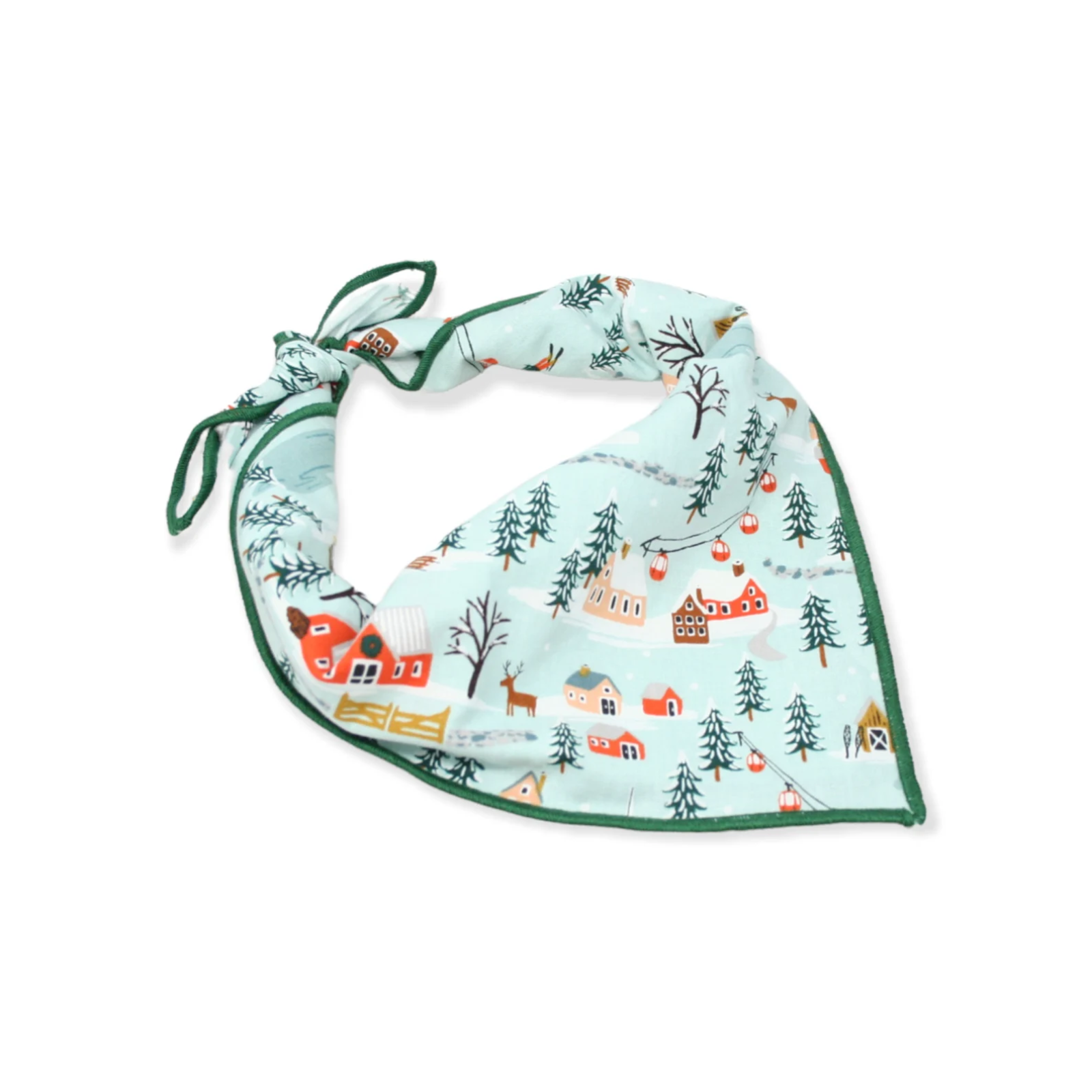 Baby bib with winter village design on a light blue background