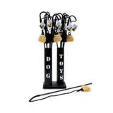 Black stand with 'DOG TOYS' text holding dog toys on a white background