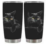 Two black tumblers with a black cat design on a white background