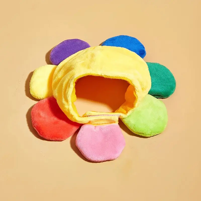 Colorful plush flower-shaped toy on a beige background