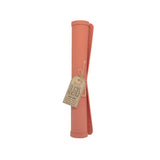 Pink silicone baking mat with a tag on a white background
