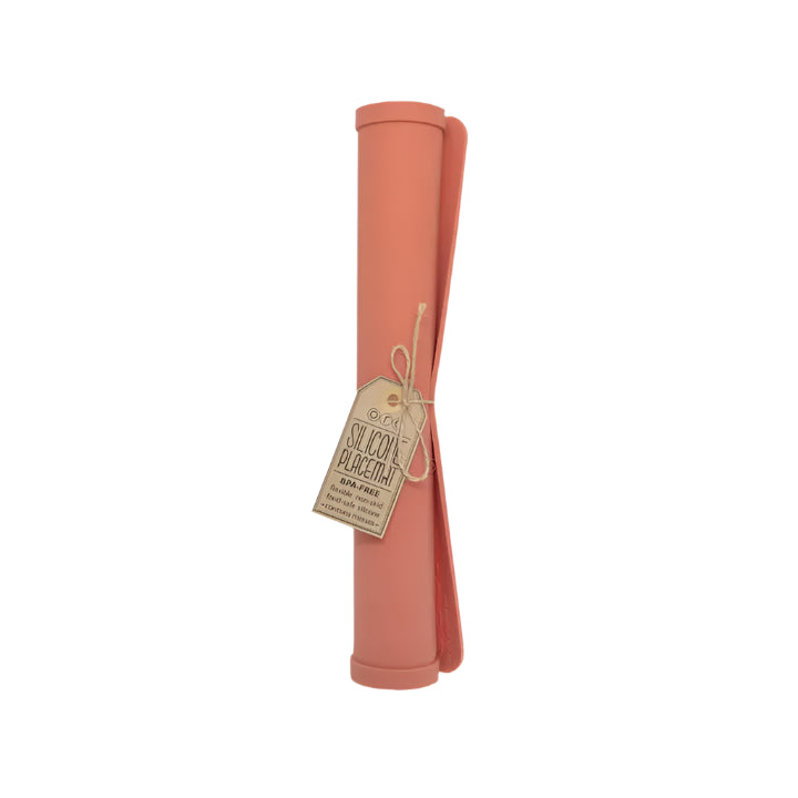 Pink silicone baking mat with a tag on a white background