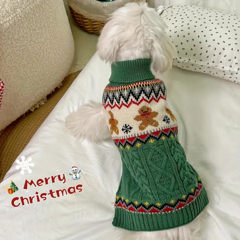 Dog wearing a green Christmas-themed sweater on a white couch.