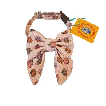 Dog bow tie with pumpkin pattern on a light gray background