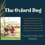 Advertisement for 'The Oxford Dog' with a family and dogs on a blanket outdoors.