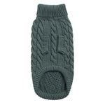 Green knitted dog sweater on a white background