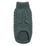 Green knitted dog sweater on a white background