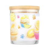 Candle with a design of cupcakes and lemons on a white background