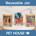 Three glass jars with colorful contents on a marble surface, branded as 'Pet House by One Fur All'.
