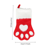 Red and white Christmas stocking with paw print design and measurements on a white background