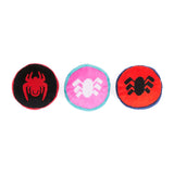 Three round toys with spider designs on a white background